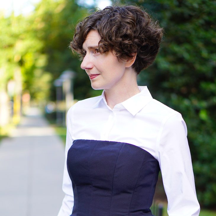 A Navy Suit with a White Blouse